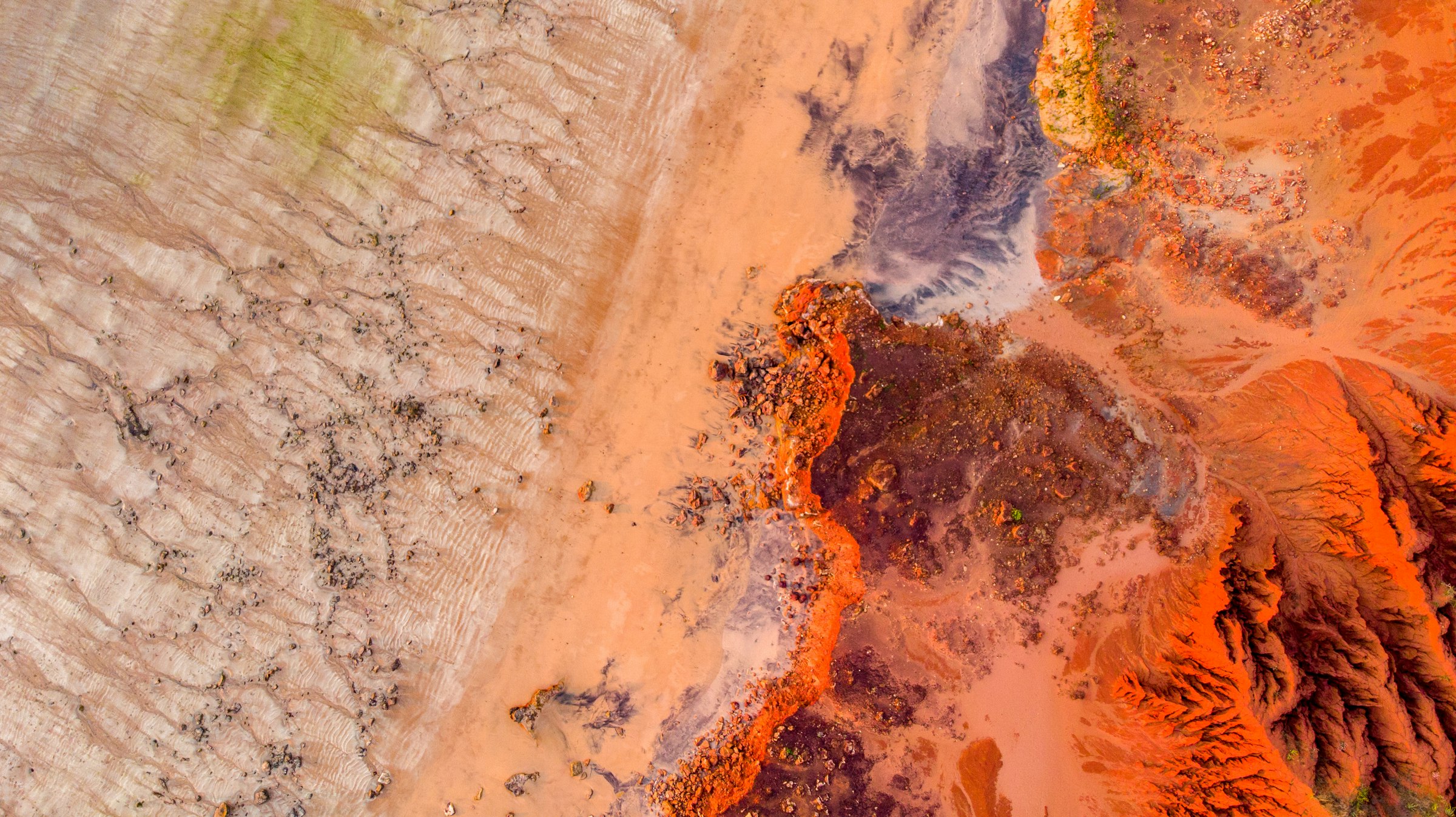 Aerial view of Pilbara ranges, red earth and spinifex in late light